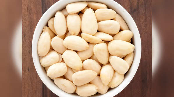 Peeled almonds revealing the inner nut