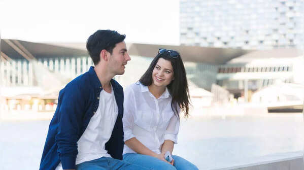 Woman looking disappointed after partner cancels plans.